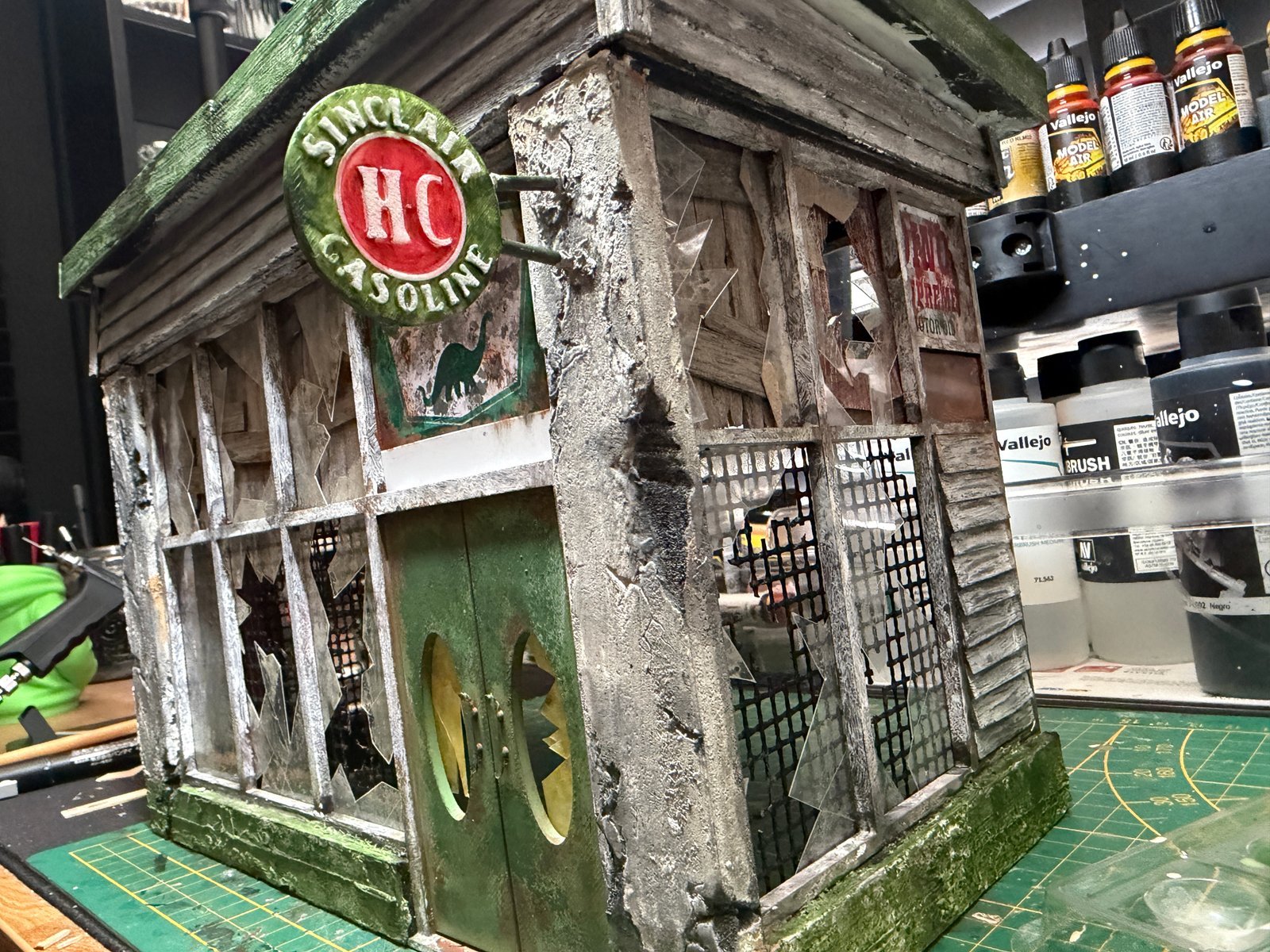 That70sGuy weathering a scale model at the workbench