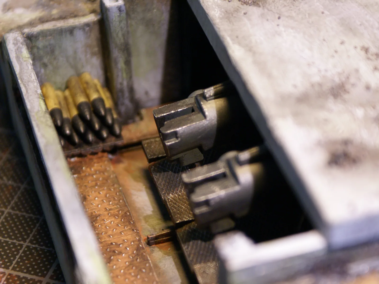 A rack of brass shells next to the guns inside the turret