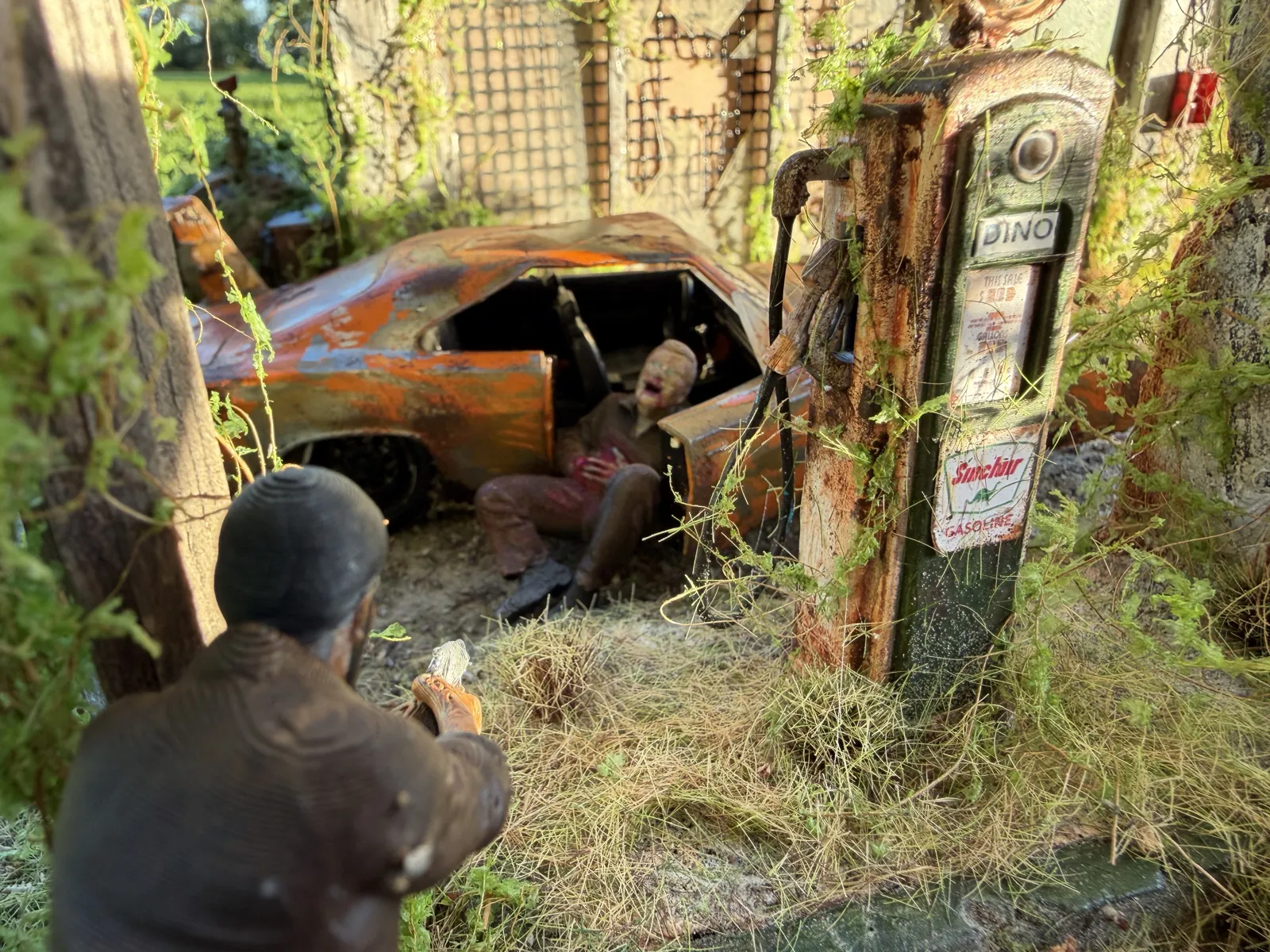 A gunman closing in on the wrecked Charger